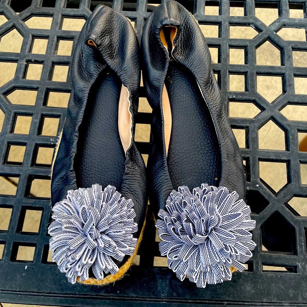 By Kate Spade. Size 8. Never worn. Black leather with striped Pom Pom.